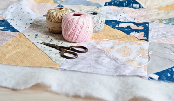 Quilting material with scissors.