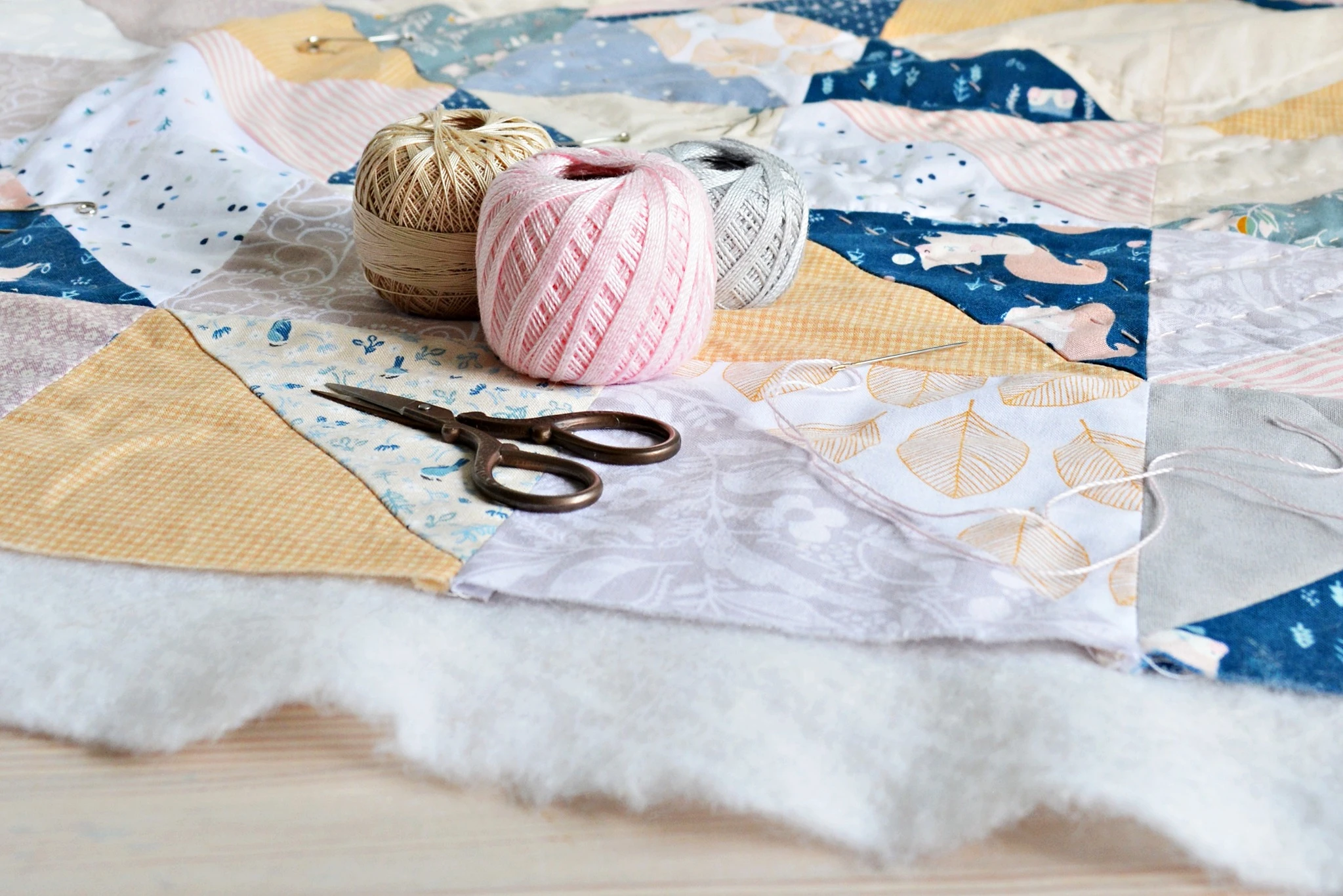 Quilting material with scissors.