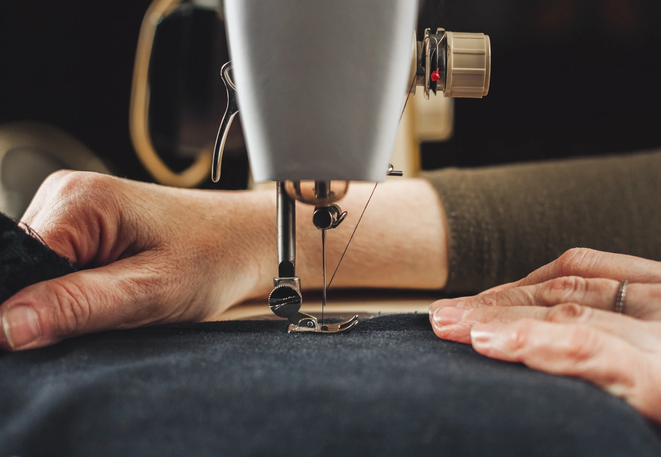 Hands at sewing machine