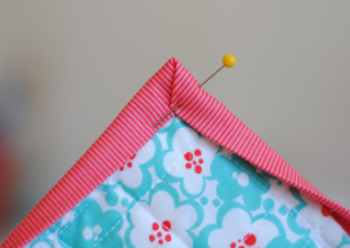 Image of a sewing pen holding fabric.