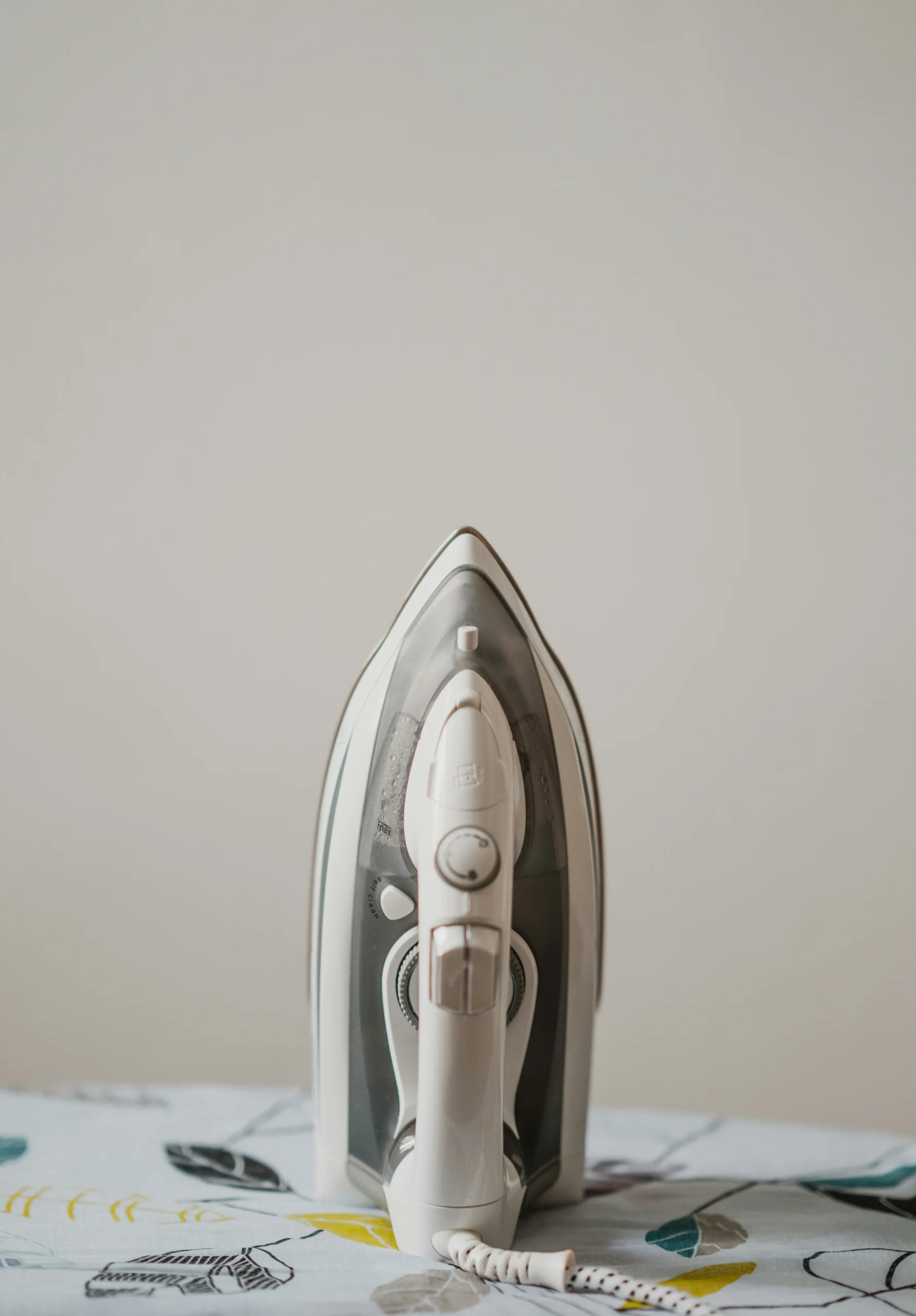 image of an iron on an ironing board